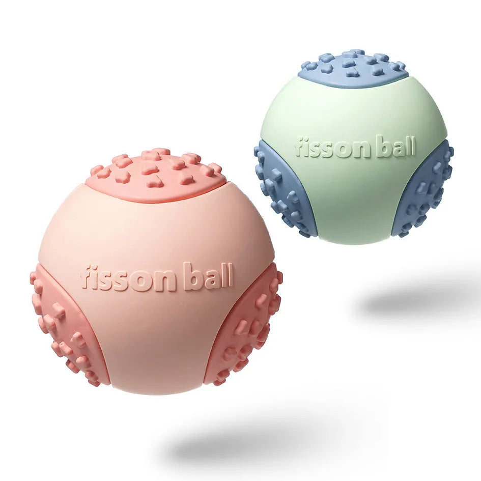 Green or pink interactive rolling ball dog toy with a durable hard plastic shell.