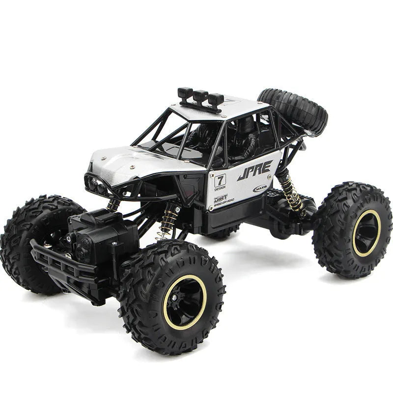 Large black 4WD off-road remote control car with 2.4G wireless controller on rough terrain