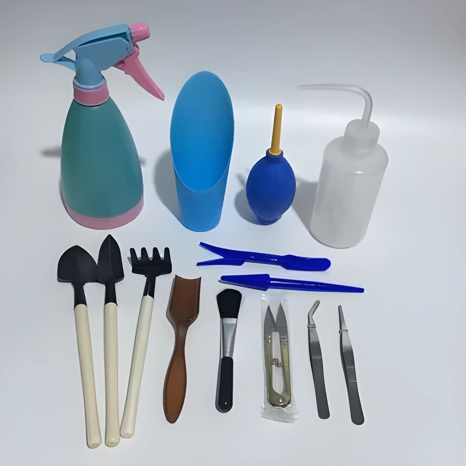 14-piece succulent gardening tool set showing drip kettle, tweezers, mini rake, and bucket for small plant care