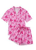 Pink bow print polyester pyjama two-piece set with separate top and trousers