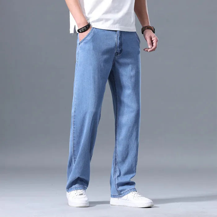 Men's loose straight leg jeans in lyocell blend fabric showing light blue colour option