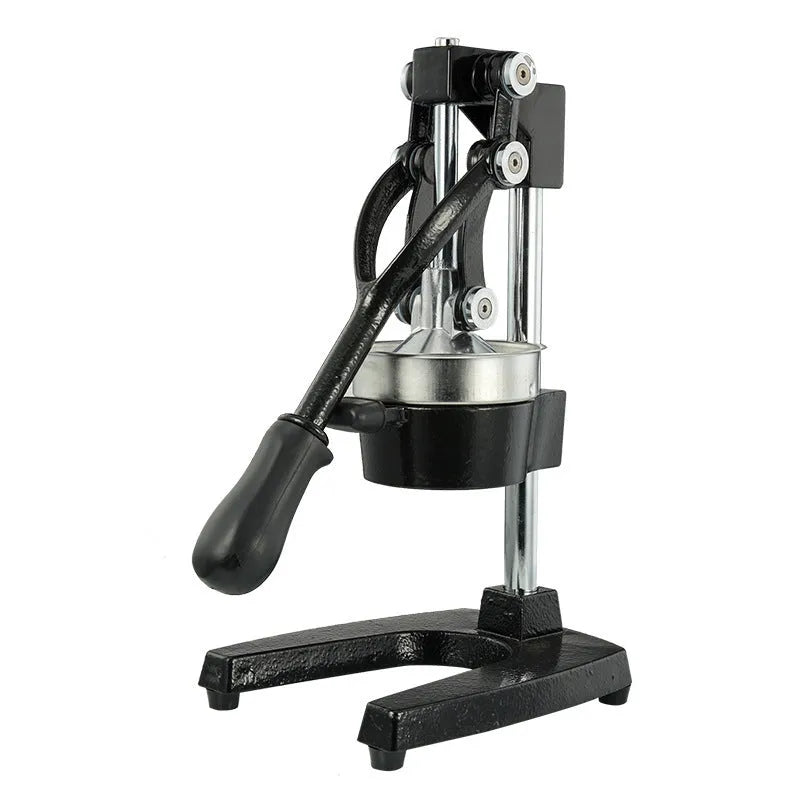 Black ductile cast iron manual citrus juicer with stainless steel strainer on a kitchen counter