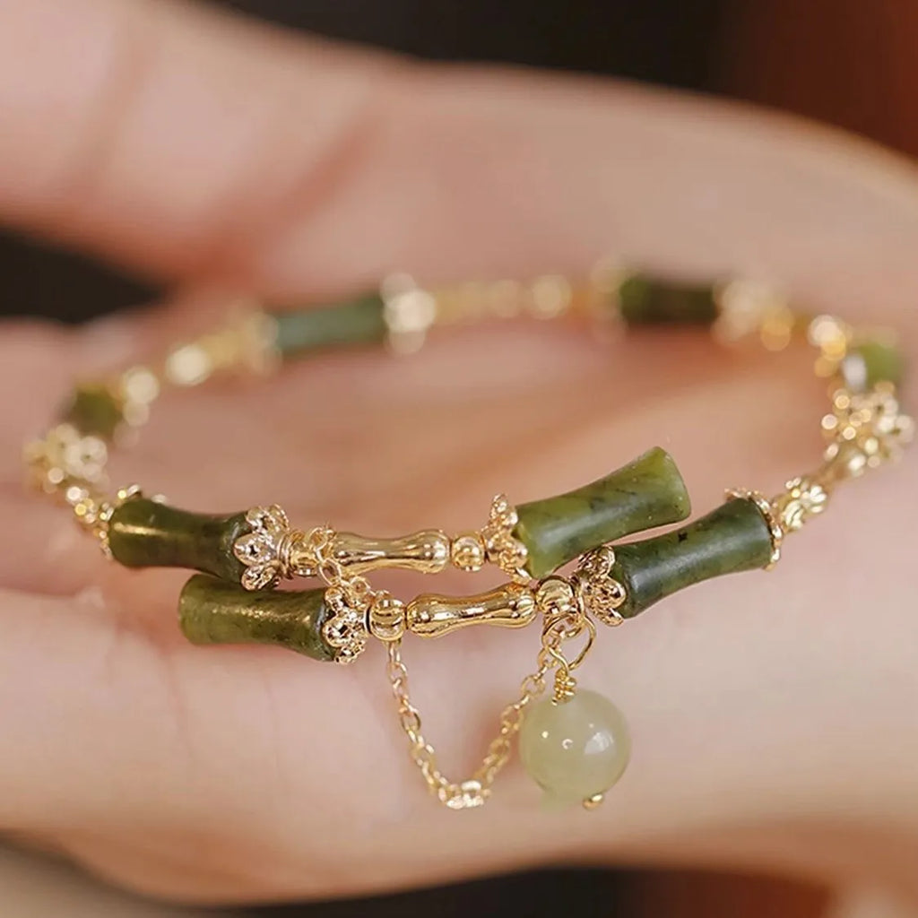 Women's plum wine coloured glaze bracelet with bamboo joint design and glossy baking varnish finish.