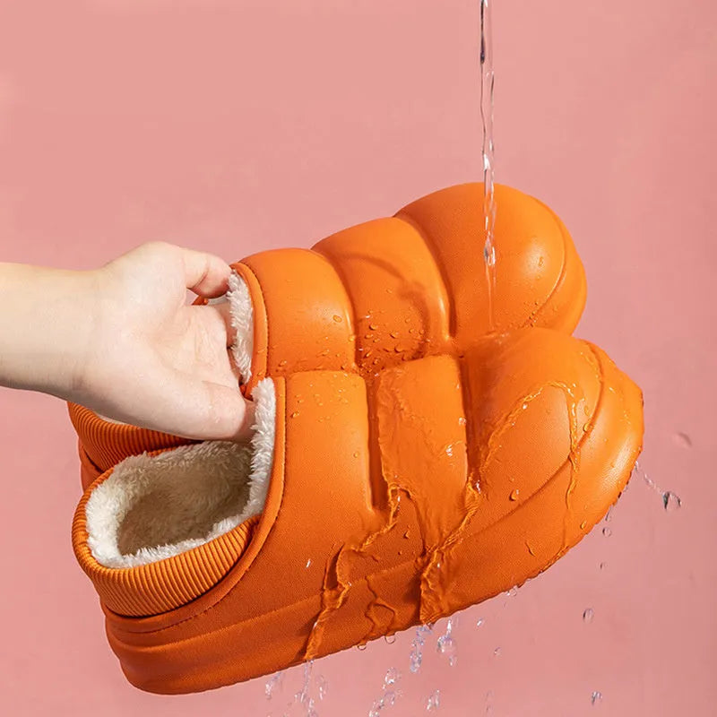 Women's winter slippers in green with plush lining and textured EVA sole, shown as sleeve-style overshoes.