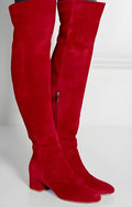 Grey suede women's over-the-knee flat boots with a pointed toe and thick low heel on a neutral background.