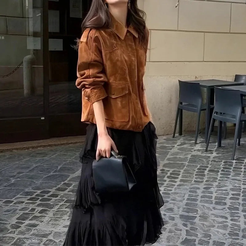 Women's brown suede-style street chic coat with regular sleeves on a hanger.