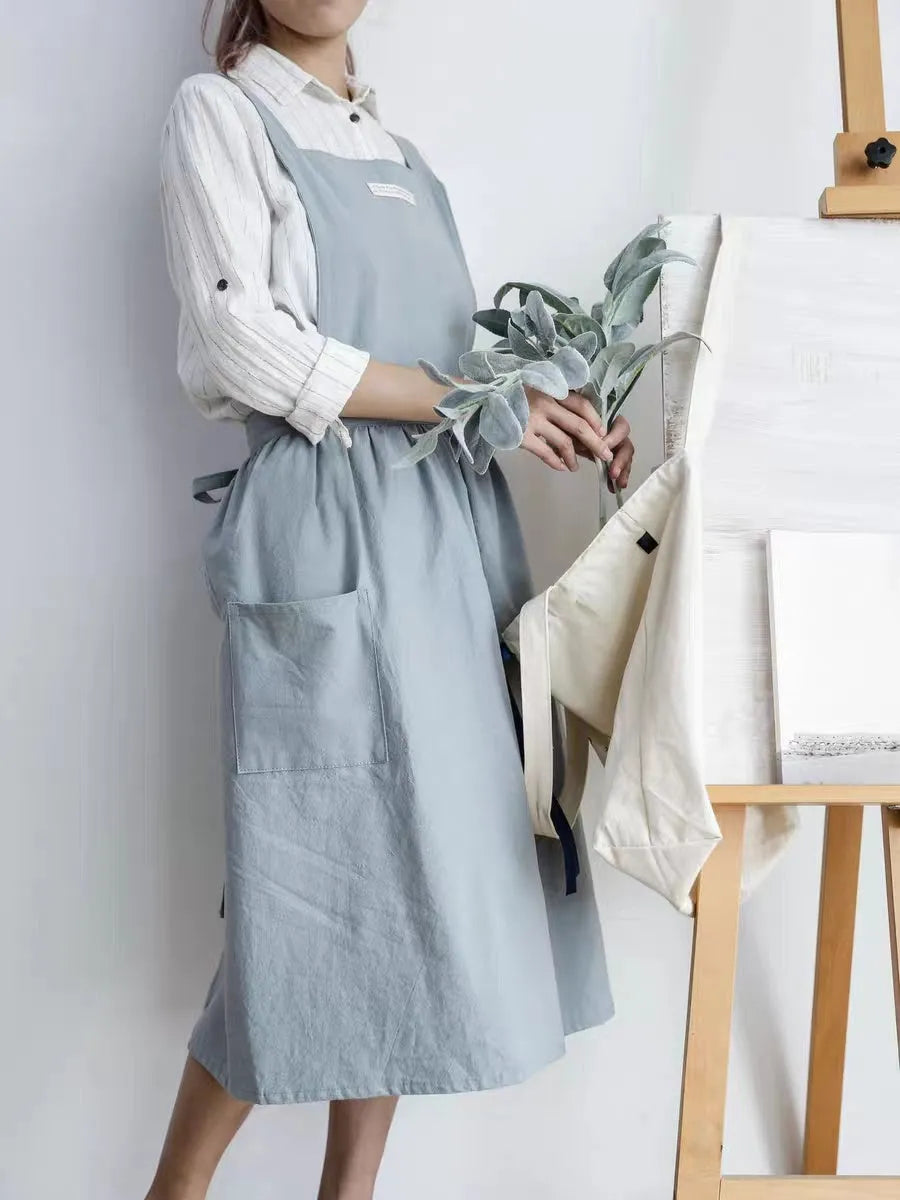 Cotton plain sleeveless kitchen apron in blue colour on white background
