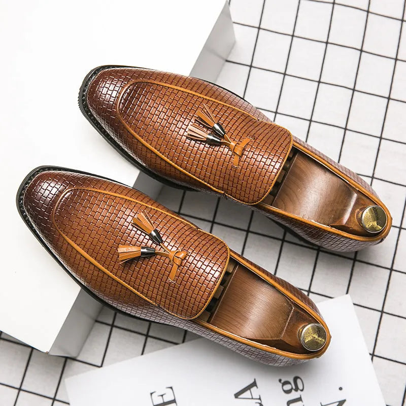 Men's black pointed toe slip on shoes with a tassel detail, made from artificial PU material for business wear.