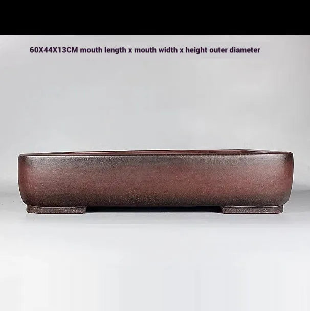 Handmade antique rectangular purple clay flower pot showing its size and shape.