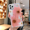 Floral iPhone case with large flower design on flexible TPU back cover in pink or yellow colour options