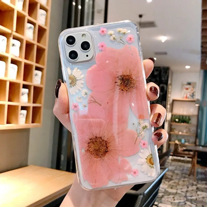 Floral iPhone case with large flower design on flexible TPU back cover in pink or yellow colour options