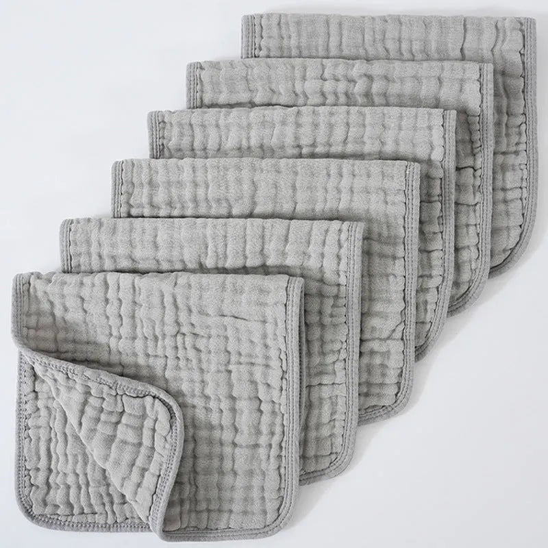 Set of six large muslin burp cloths 25x50cm in assorted colours on white background