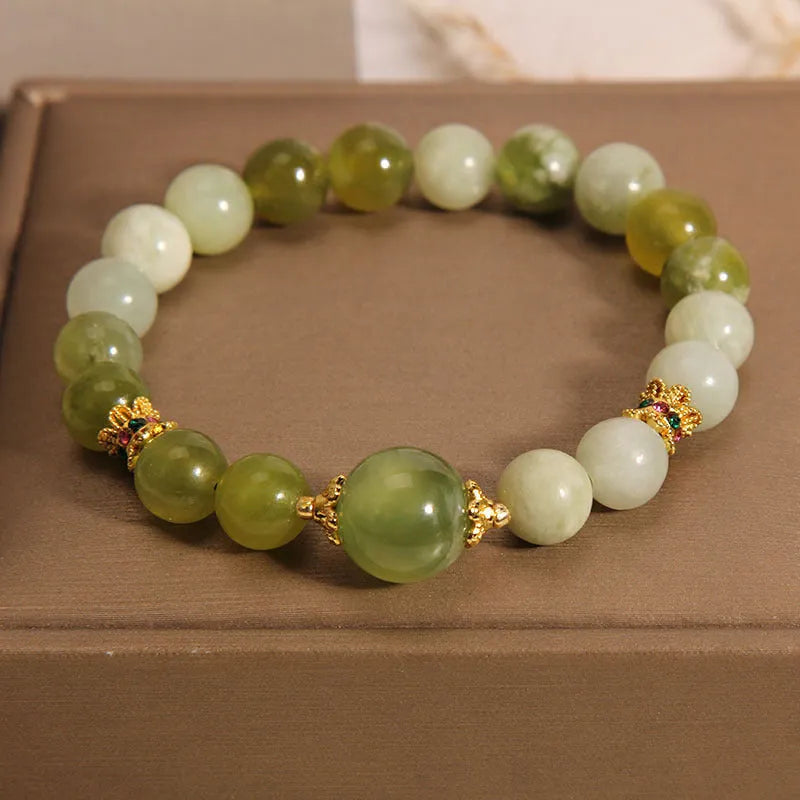 Xiuyan jade green mori-style women's bracelet with original design on a white background.