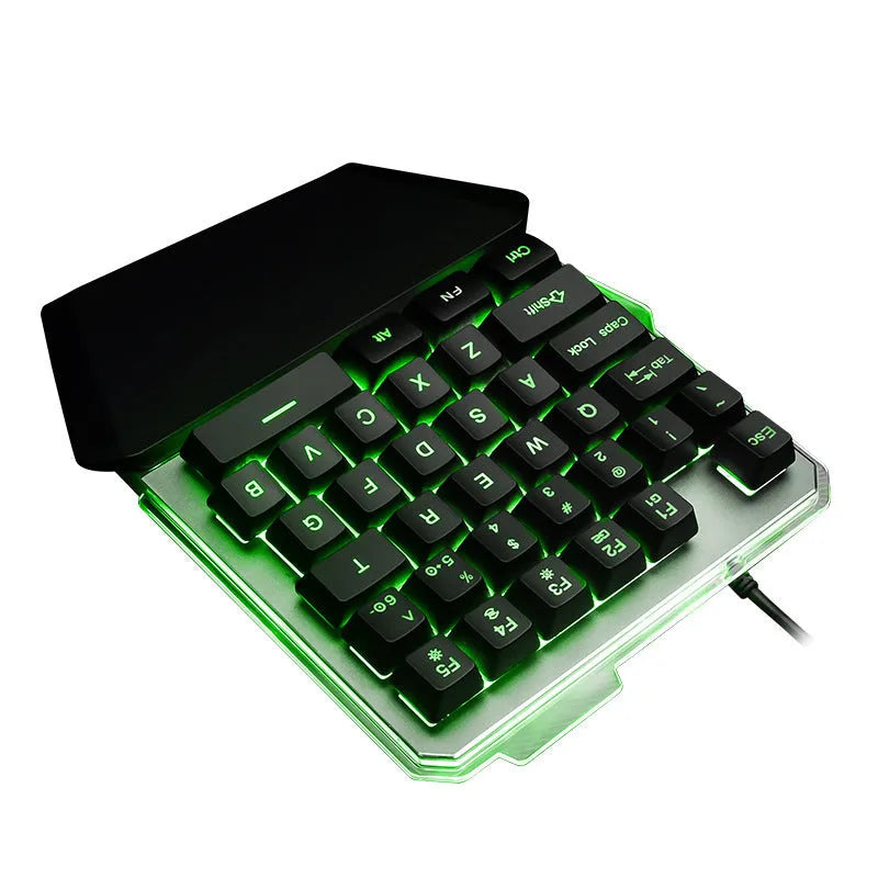 Black G40 Flow one-handed mechanical keyboard with RGB backlit keys on a desk