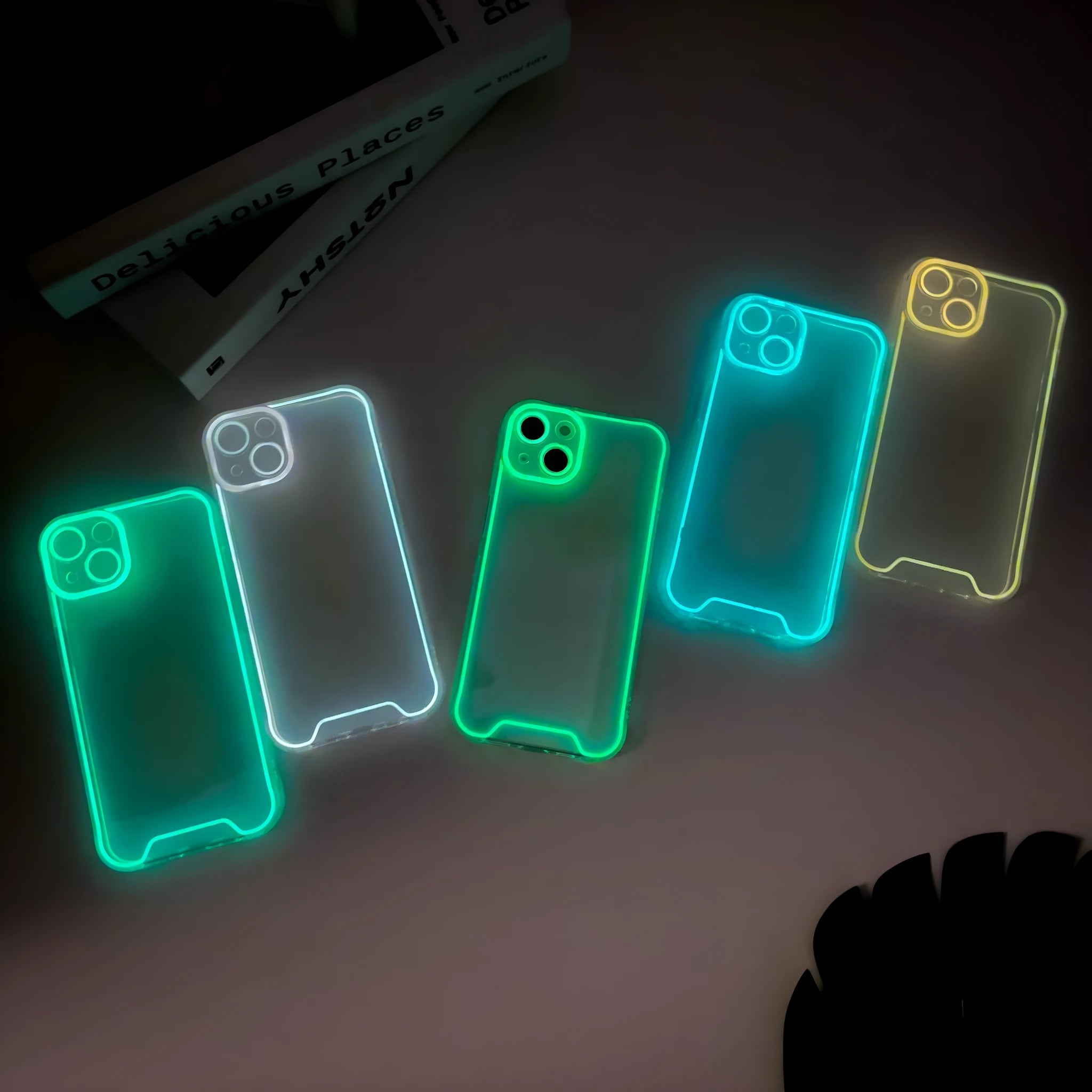 Glow in the dark green Christmas phone case for iPhone on a dark background.