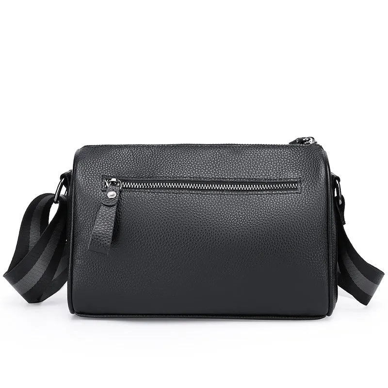 Black genuine leather one-shoulder crossbody bag showing its large capacity and strap.