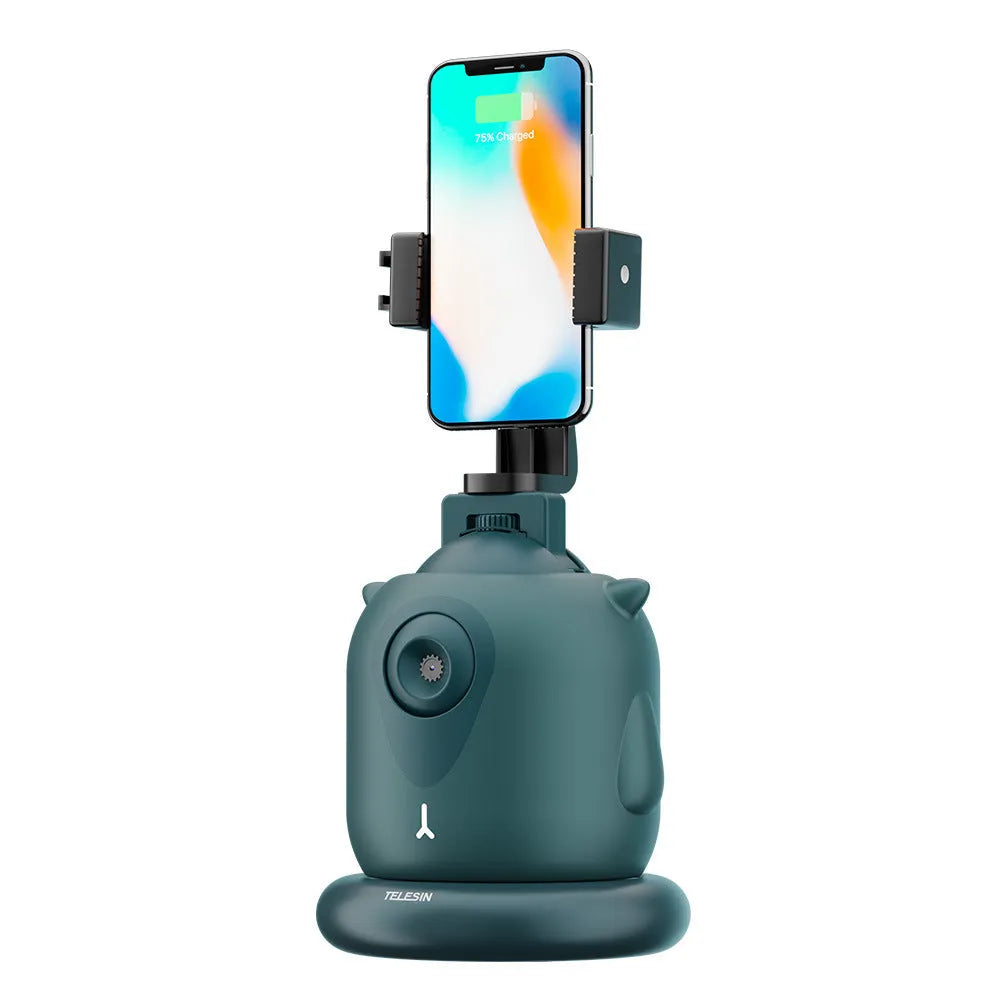 Dark green intelligent AI face recognition gimbal with 360-degree rotation on a desk.