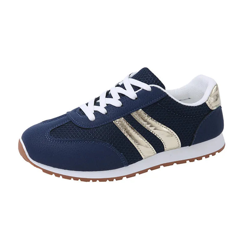 Blue women's lightweight sports shoes with cross straps and lace-up front on a flat rubber sole.