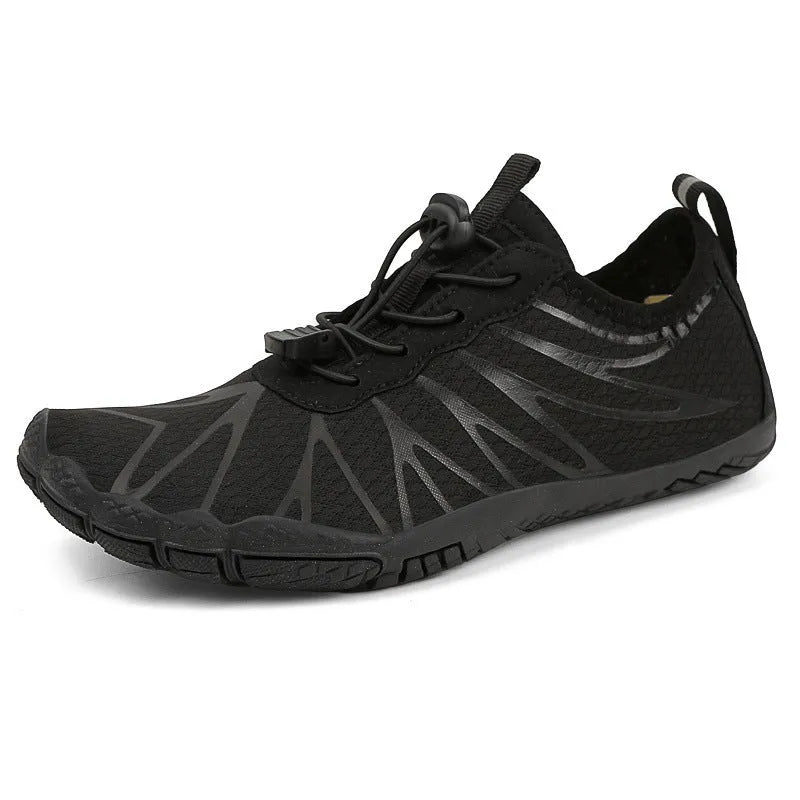 Casual low-top running shoes in black and white colourway with front lace-up closure.