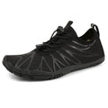 Casual low-top running shoes in black and white colourway with front lace-up closure.