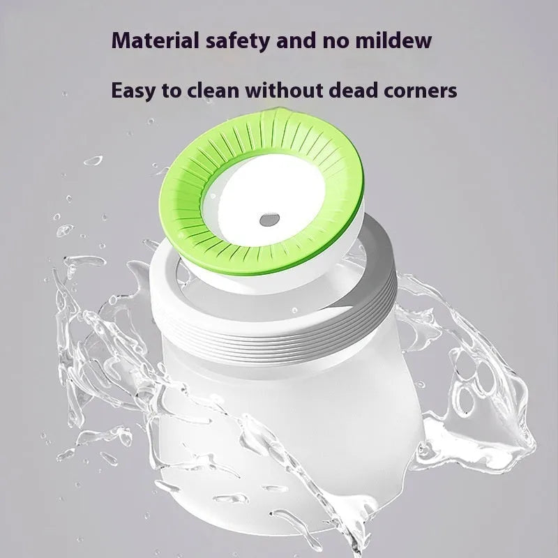 Green pet suspension water bowl for dogs and cats on a matching plate.