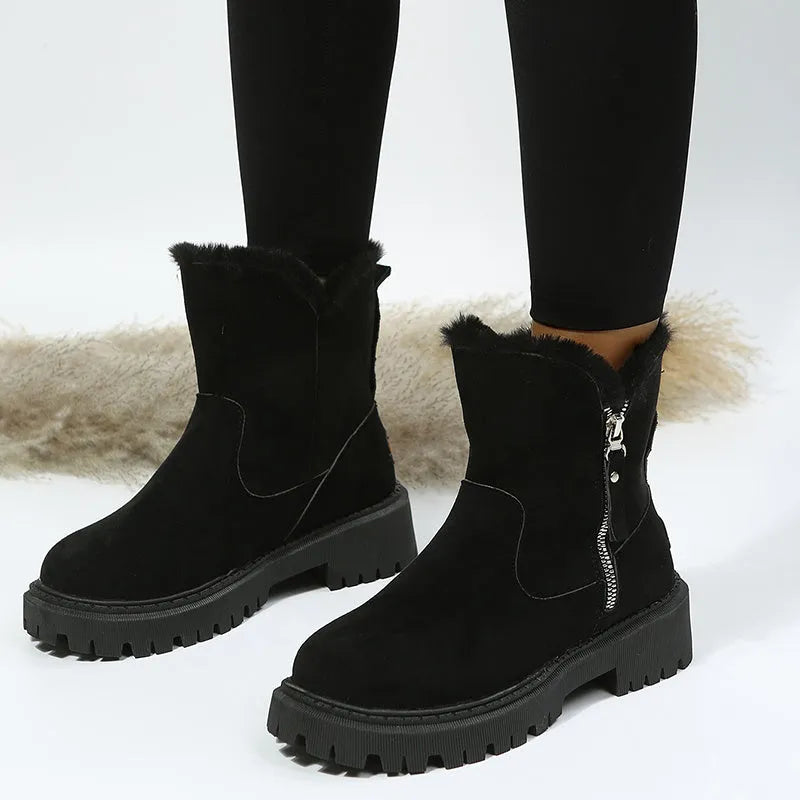 Women's black thick plush snow boots with side zipper and faux suede upper on a non-slip rubber sole.