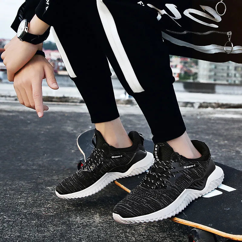 Adult breathable running shoe with mesh upper, front strap, and MD sole on a white background.