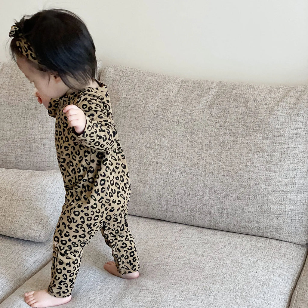 Brown leopard print cotton long-sleeved baby jumpsuit with matching headband, neutral unisex style