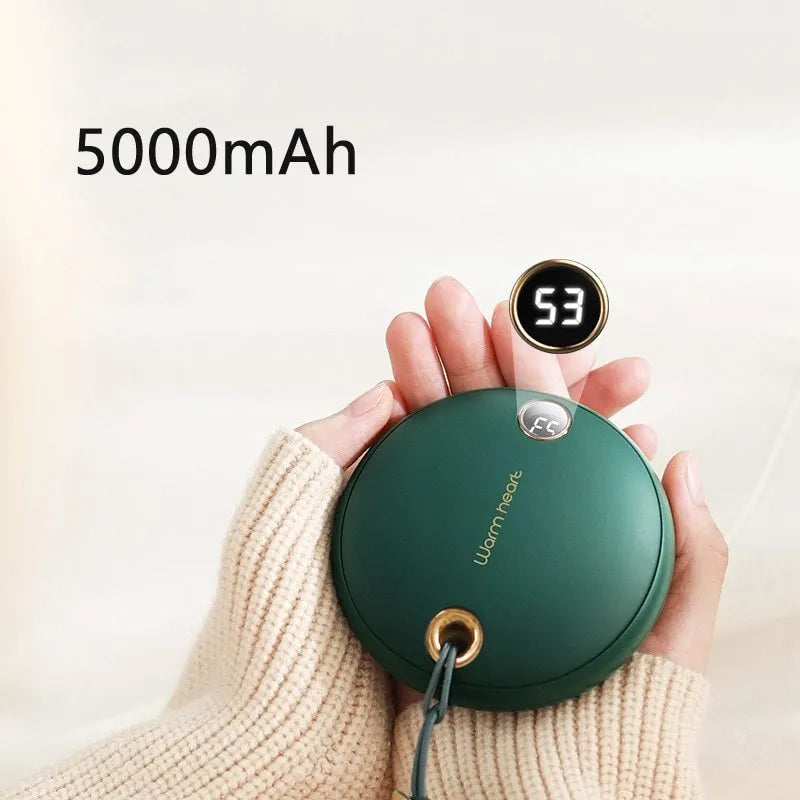 Green hand warmer power bank with digital display showing battery level, next to a USB-C cable.