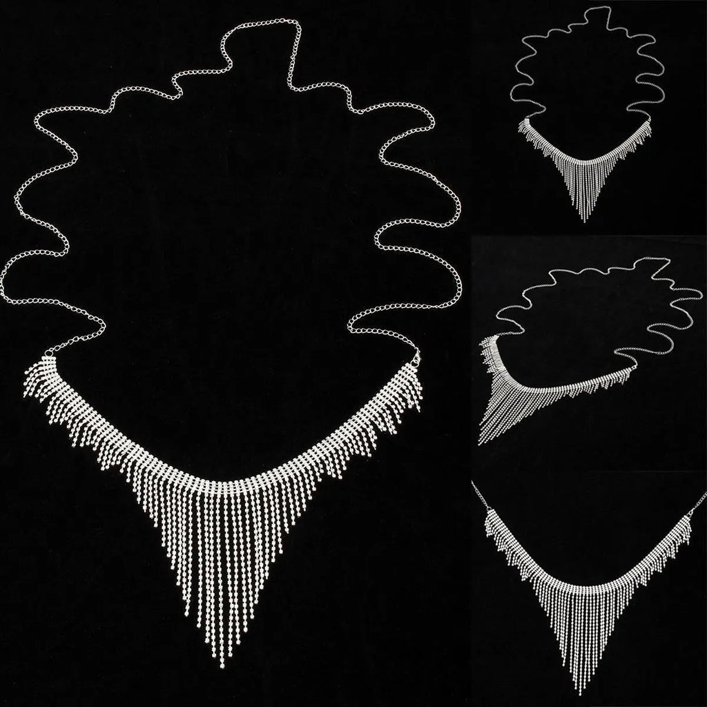 Silvery rhinestone body chain laid flat on a white surface showing metal links and clear stones