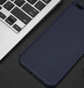 Black TPU silicone protective case fitted on an iPhone, showing precise cutouts for camera and ports.
