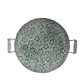Round wrought iron belt storage tray set in two sizes on a wooden table.