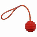 Multi-colour rubber dog chew ball with rope knot design measuring 6x30cm