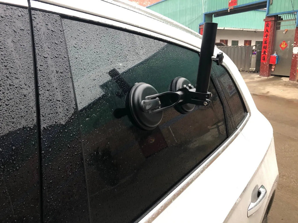 Black off-road car glass sucker base with round rubber disc for windscreen mounting.