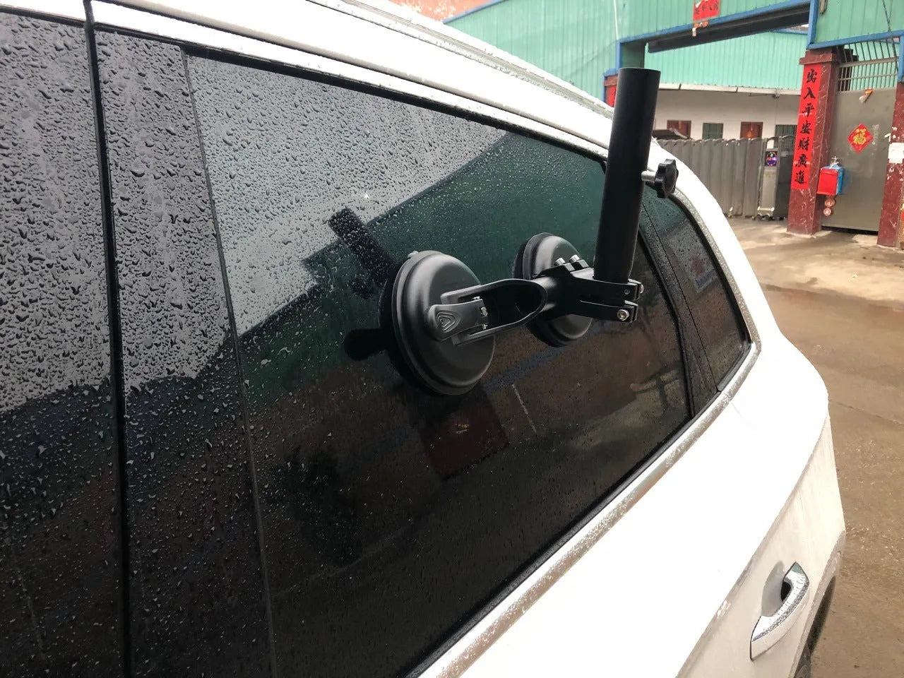Black off-road car glass sucker base with round rubber disc for windscreen mounting.