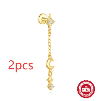 S925 sterling silver geometric moon and star earrings with diamond detail on a gold tone background.
