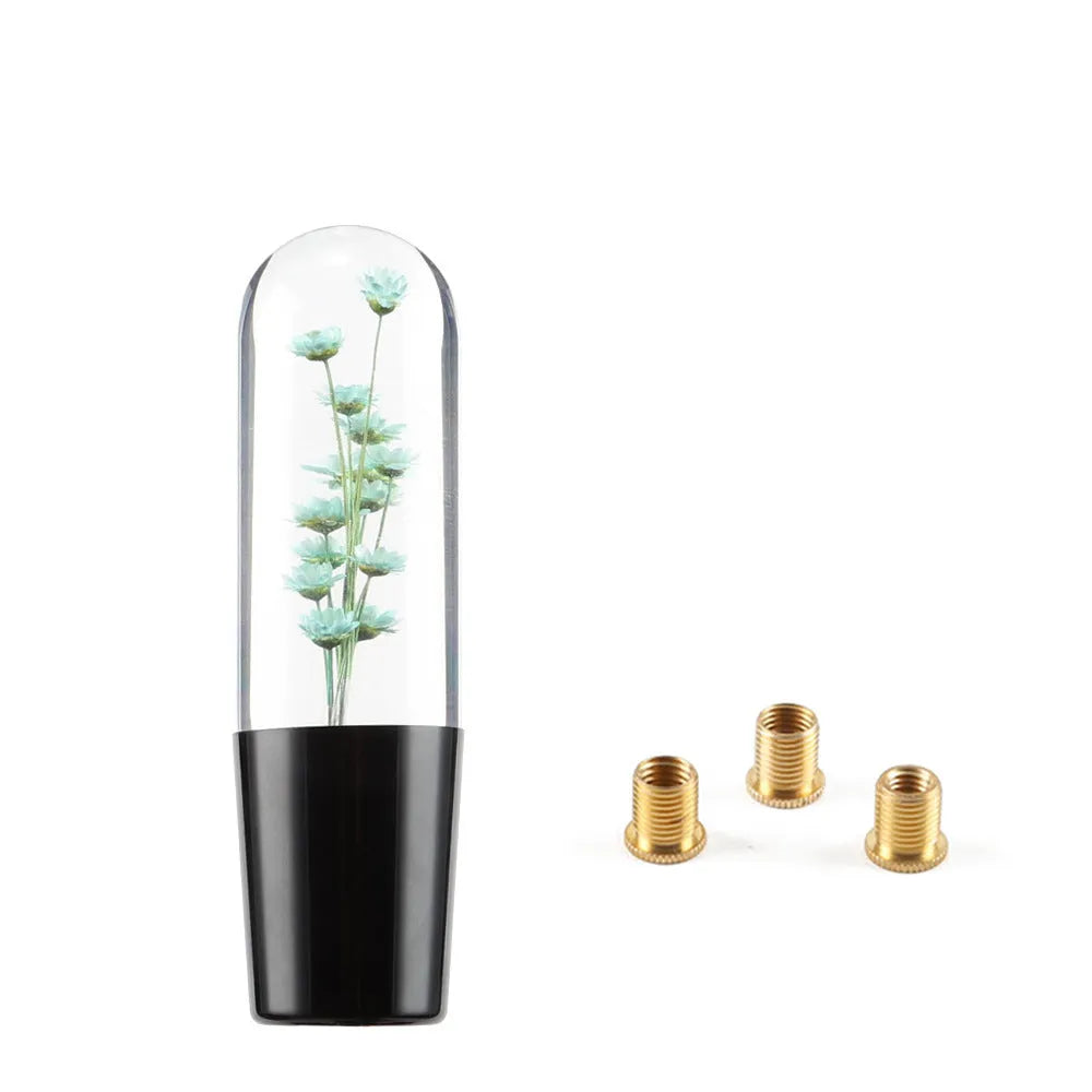 15cm tall transparent crystal car gear knob with internal flower decoration on a gear lever