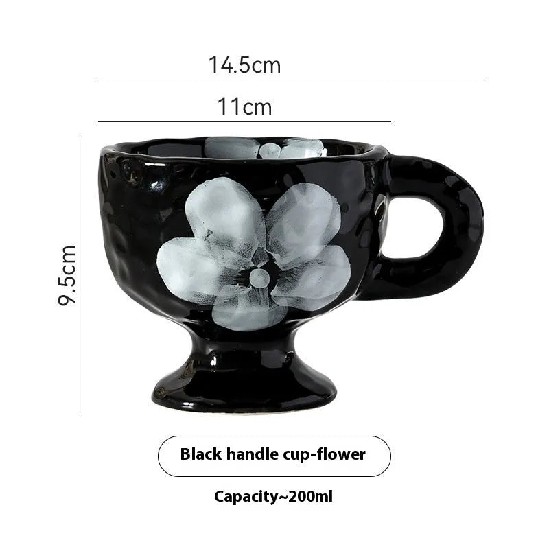 Hand-pinched irregular ceramic mug in a solid colour, showing its unique shape and modern design.