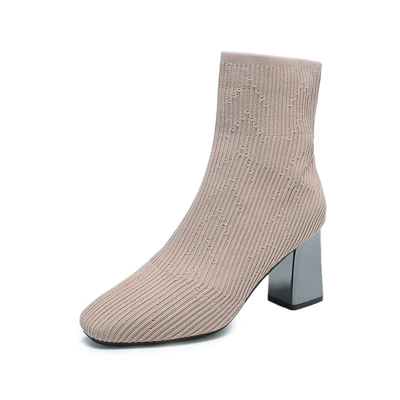 Women's stretch sock boots in black with short chunky heel and rubber sole