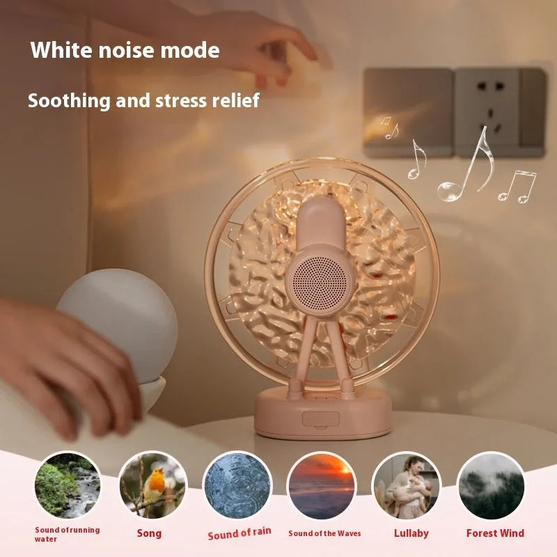 Pink and white Bluetooth speaker projecting colourful Ferris wheel and water ripple LED light patterns