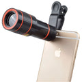 12X magnification phone telescope lens with mounting clip on a mobile phone
