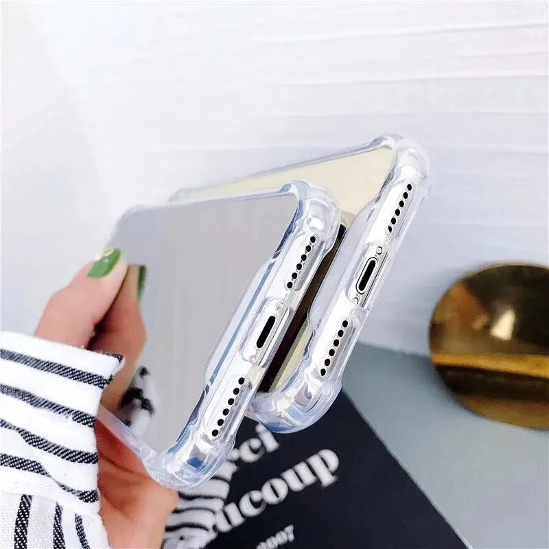 TPU mirror phone case for iPhone on a table, showing anti-fingerprint finish.