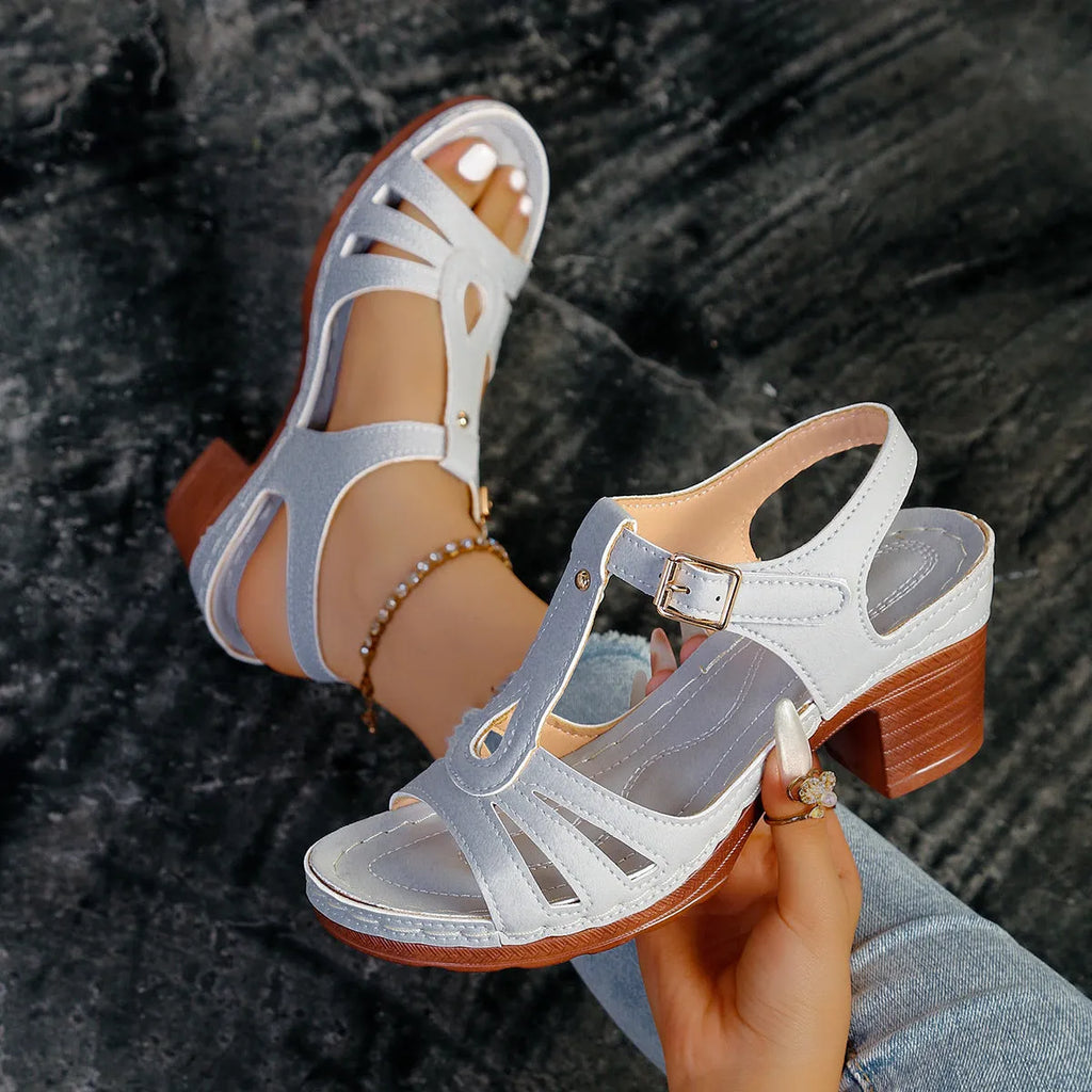 Women's black peep toe wedge sandals with a buckle strap on a polyurethane sole.