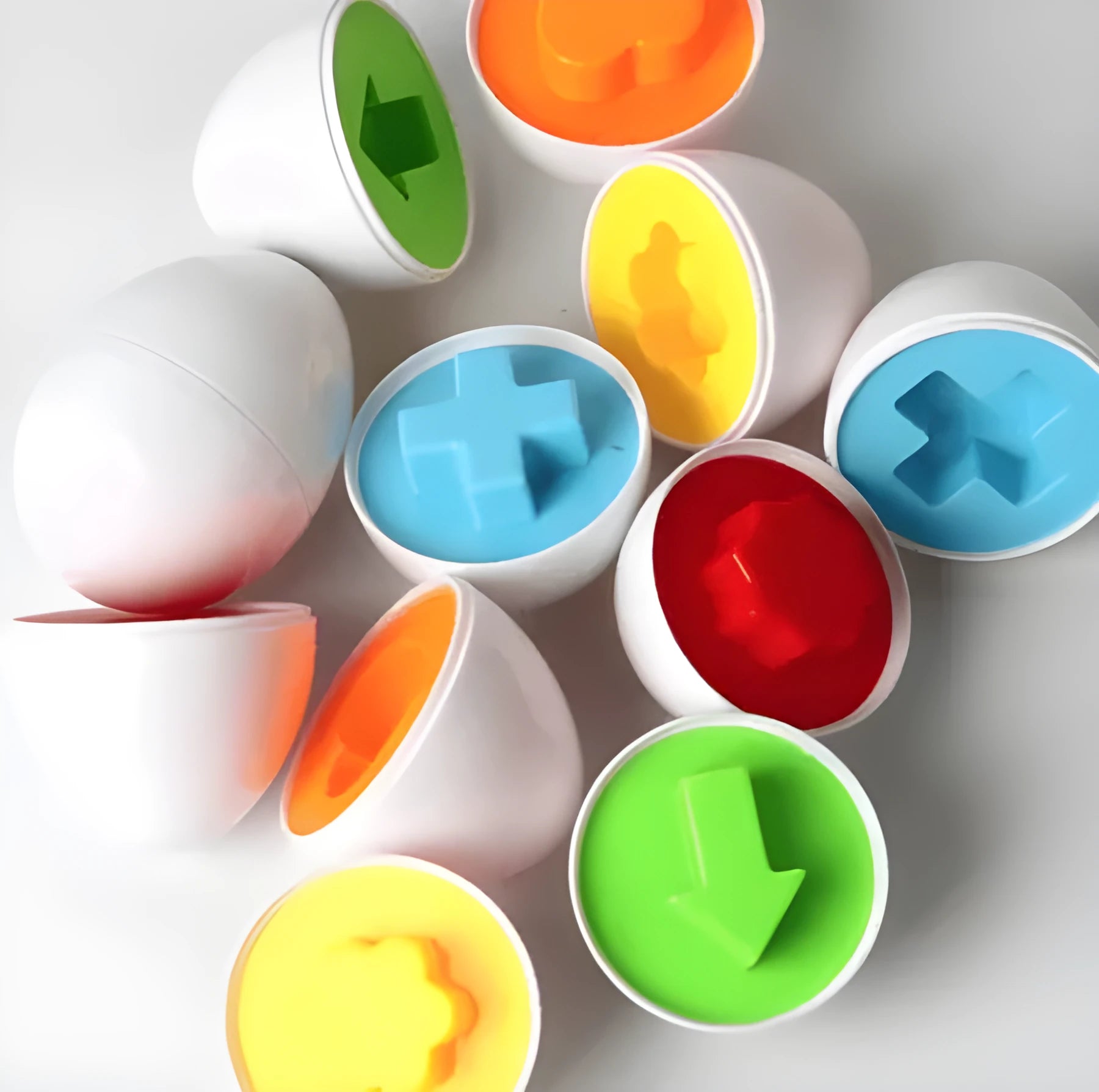 Children's educational twist egg toy set with 12 colourful dinosaur-themed plastic eggs in a drawstring bag
