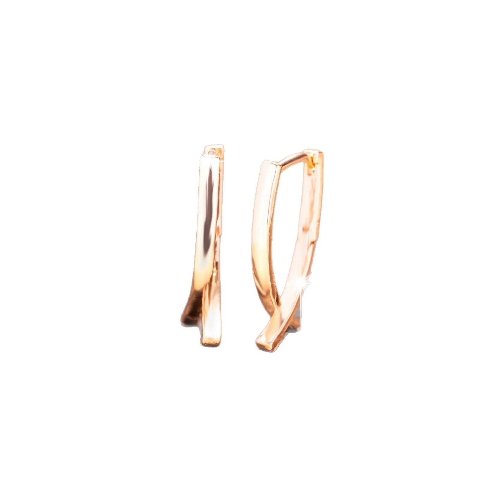Rose gold plated cross earrings on a white background, showing post and clutch fitting.