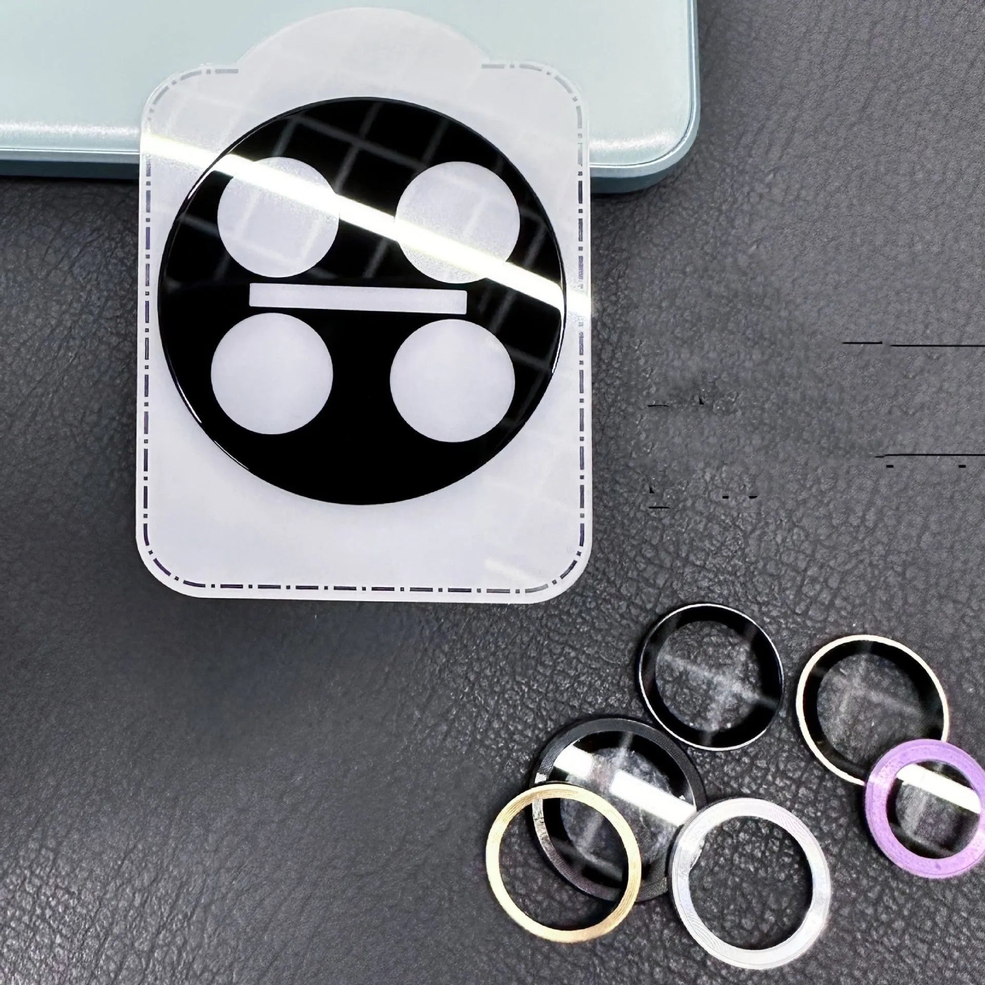 Tempered glass lens protector for OnePlus 12, Find N3, and OnePlus 11 front camera with black ring.