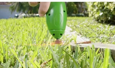 Cordless lawn trimmer with extension pole and protective debris shield for garden maintenance