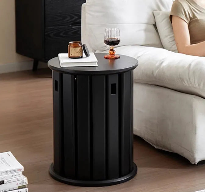 Stackable round iron dining stool in a modern style, shown in a choice of smoked black, walnut, cherrywood, or cream colour.