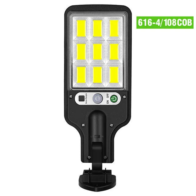 Outdoor solar LED wall lamp 28LED variant mounted on a garden fence for patio lighting