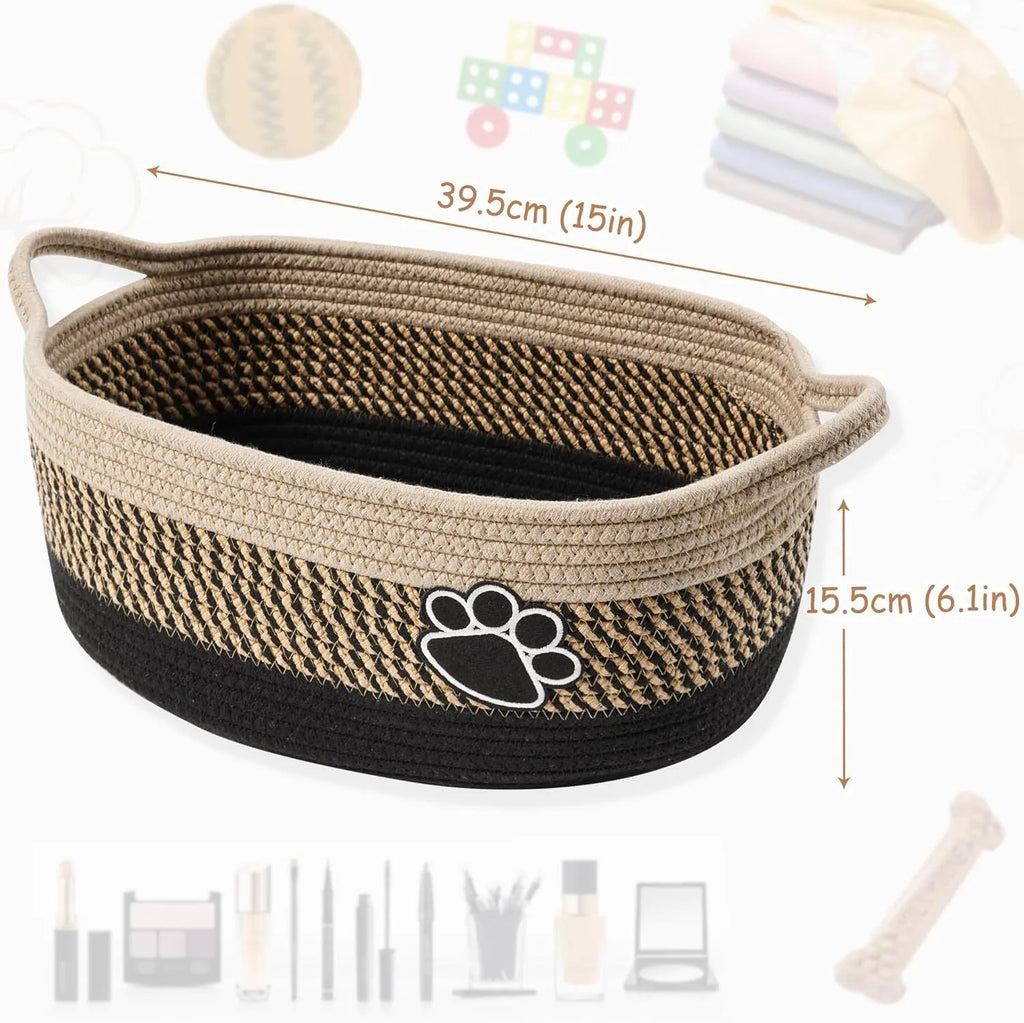 Light beige handmade cotton rope woven storage basket with handle on a wooden base.